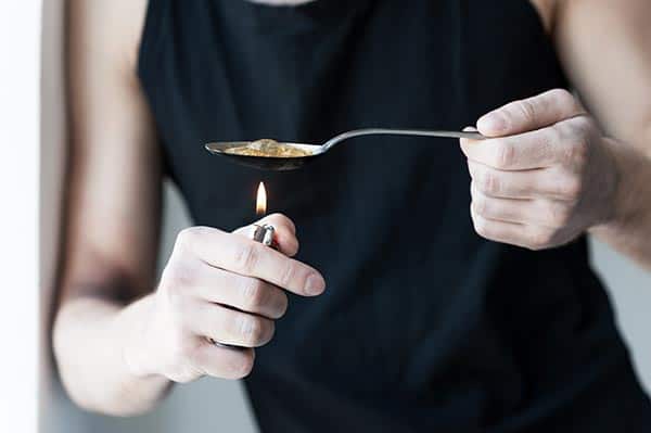 Boiling Heroin with Spoon